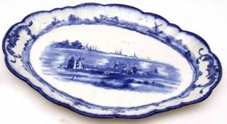 A Doulton Burslem Double-Handled Shaped Oval Meat Plate, typically decorated in blue, 17 ½” long