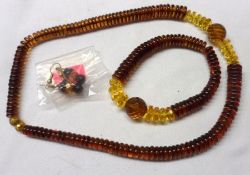 A Graduated Amber Disc Necklace, Bracelet and Earrings Set, approximately 33 gm
