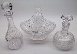 Two Modern Lead Crystal Decanters, one of bottle shape and the other of shaft and bulb form;