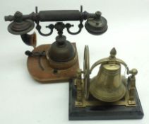 A Novelty Brass Desk Table Bell on an ebonised stand; together with a further Vintage Model of a