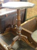 A Victorian Oak Pedestal Table, the octagonal top moulded around the border with foliage and