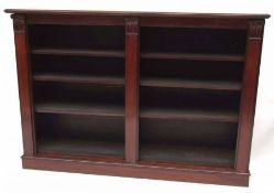 A Victorian Mahogany Bookcase, of rectangular form with moulded edge, the front with three plain