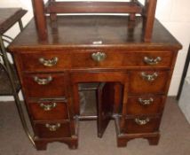 An early 18th Century Walnut Small Desk, the quarter veneered herringbone banded and crossbanded top