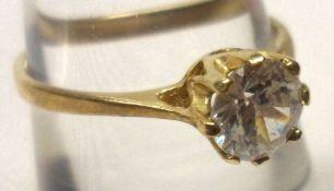 A yellow metal single white stone Ring, stamped “9ct”