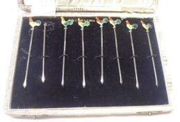 A Cased Set of seven (of eight) white metal Cocktail Sticks, with enamelled cockerel finials (one