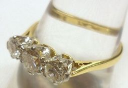 An 18ct Gold and Platinum three stone Brilliant Cut Diamond Ring, approximately.9ct total