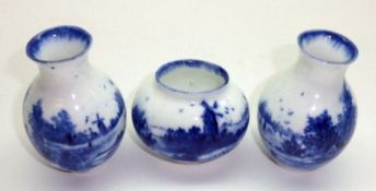 A pair of Royal Doulton “Norfolk” pattern Miniature Vases; together with a similar small Squat