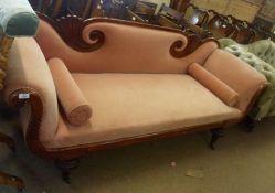 An early 19th Century Mahogany Sofa with fan-moulded scrolled back and scrolled arms over a torus