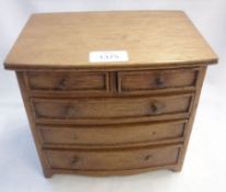 A 20th Century Oak Apprentice style Bow Front Five Drawer Chest (handles missing from two of five