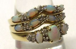 A hallmarked 9ct Gold three-part Ring Set, small Opal and small Diamond set (3)