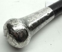 An Ebonised Walking Cane with hallmarked silver button handle, 35 ½” long