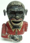 A reproduction Novelty Moneybox “Jolly Nigger” (paint losses), 6” high