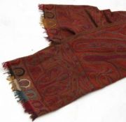 A large early 20th Century Norwich type Woven Paisley Shawl, measuring 131” x 51” approximately;