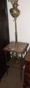 An unusual late Victorian Combination Oil Lamp and Magazine Rack, the brass oil lamp on adjustable