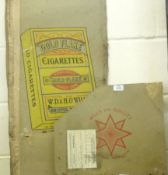 A Wills Gold Flake Cigarettes Cardboard Former Packing Case Top, decorated with a stylised cigarette