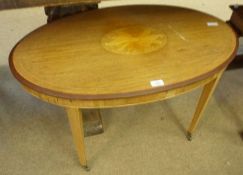 An Edwardian Oval Mahogany Occasional Table, the centre inlaid with large floral detail, raised on