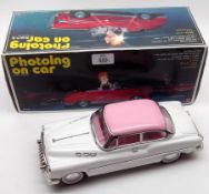 A Chinese Tinplate “Photoing on Car” in original box and a further Chinese Tinplate Model of a 1950s