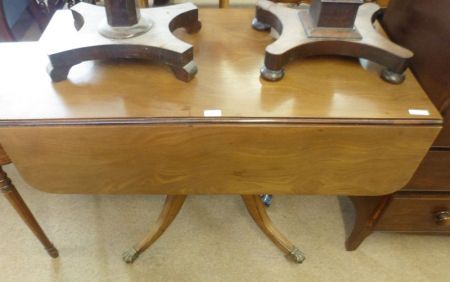 A Rectangular Mahogany Drop Leaf Pedestal Pembroke Table, with two drawers on a turned column,