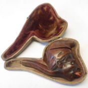 An interesting cased Carved Wood Pipe with hinged cover, of a Negro Head, 3 ½” long (lacking