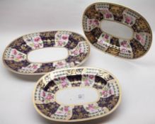 A Graduated Set of three Bloor Derby Oval Platters, each painted in colours with panels of roses