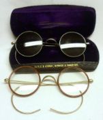 A pair of early/mid-20th Century white metal framed circular lens Sunglasses and similar pair of