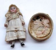 A small early 20th Century Mignonette Doll, all bisque, painted eyes, lashes and lips, blonde wig,
