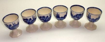 A Set of Six Royal Doulton “Norfolk” pattern Eggcups, 2 ½” high, typically decorated in blue