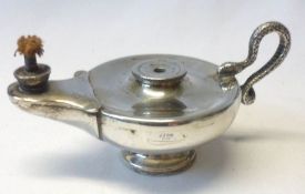 An Edwardian Table Lighter in the form of an Aladdin Oil Lamp, serpent handle, 5” long, 2 ¾”