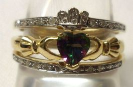 A Claddagh style three-part stone set Ring in 9ct Gold