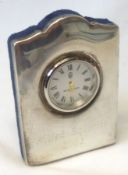 An Elizabeth II Silver Mounted Quartz Timepiece, the shaped and polished rectangular case with