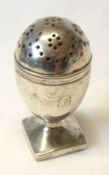 A George II ovoid shaped Pepperette to a square base, 3” tall, London 1808, makers marked rubbed,