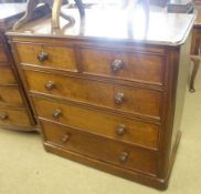 A Victorian Mahogany Chest of Two Short Over Three Long Drawers, with turned knob handles, on a