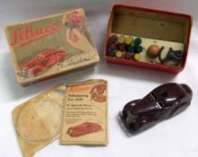 A boxed Schuco Fermlenk-Auto, Red Maroon, Plastic Clockwork Motor Car with Skittles, Ball etc (