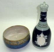 A Royal Doulton Stoneware Circular Bowl, the rim moulded with rosettes and decorated in blue and