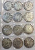 Packet: twelve Chinese Silver Commemorative Dollar-sized Coins (12)