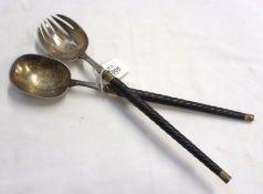 A pair of late 19th Century Serving Spoons, one with cut tines, and both with engraved bowls, ribbed