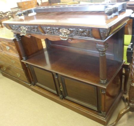 A late 19th Century Mahogany Two Tier Buffet, with a galleried pediment crested with ball finials