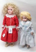 Two unmarked small Bisque Head Dolls, damage to both (2)