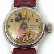 A 1934 Mickey House Wristwatch, manufactured by Ingersoll (replacement leather strap)