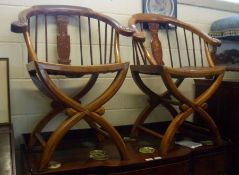 A near pair of 20th Century Oriental Hardwood Bow Back Armchairs, central splats decorated with