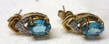 A pair of yellow metal Ratanakiri Zircon and small Diamond mounted Earrings