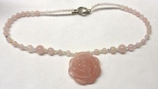A rose-head design Rose Quartz Pendant with Rose Quartz and Crystal Necklace mount