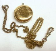 An early 20th Century hallmarked 9ct Gold Circular Locket, engraved with initials “GHM” in