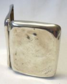 A Cigarette Case of curved rectangular form, gilt lined, measuring 3 ½” x 2 ¾”, inscribed to