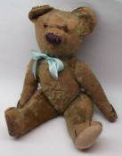 A mid-20th Century Mohair Teddy Bear with amber glass eyes, brown wool stitched nose, replacement