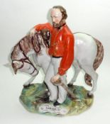 A 19th Century Staffordshire Large Model “Garibaldi”, standing beside his mount and wearing an