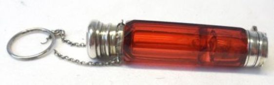 A Victorian Facetted Ruby Glass Small Double-Ended Scent Bottle, with white metal hinged lid to