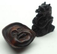 An Oriental Hardwood Netsuke, modelled as the head of a Noh Play Actor; and one other modelled as
