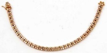 A good quality hallmarked 18ct Gold Line or Tennis Bracelet, set with in total 148 Round Brilliant