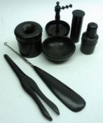 An early 20th Century Ebony Part Dressing Table Set, comprising Shoe Horn, Tongs, Hair Tidy etc (7)